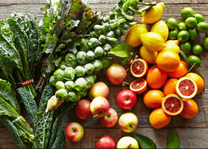 a group of fruits and vegetables on a wood surface Healthy Weight Loss Diets Macclesfield
